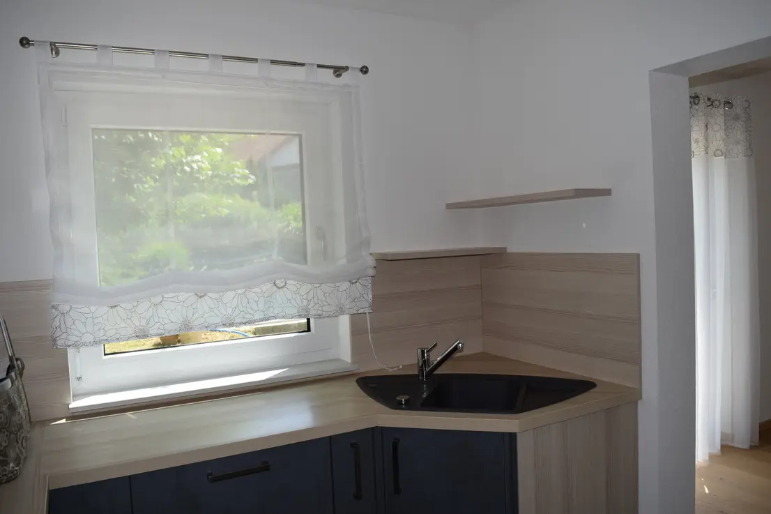 Michaela Hain Immobilien - Wohnung Wohnzimmer mit großflächiger LED